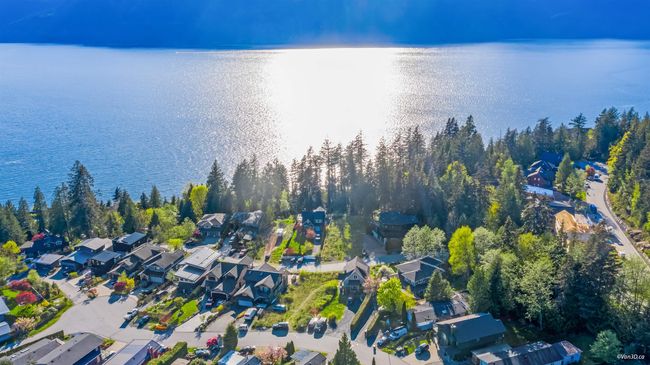 Aerial view of residential area featuring a nearby body of water | Image 15