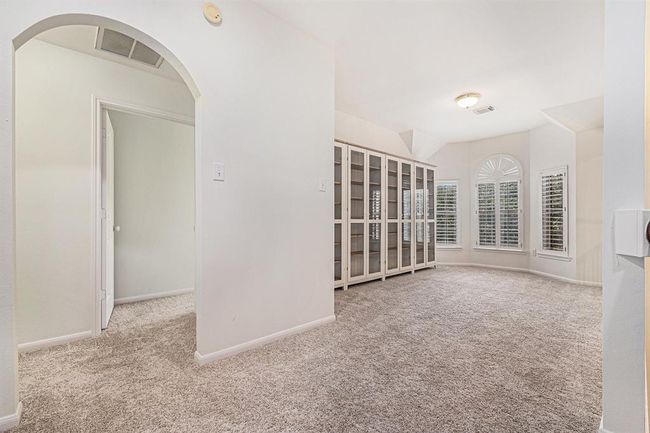 The game room has a wall of bay windows with Plantation shutters and is ready for whatever your hearts desires! | Image 25