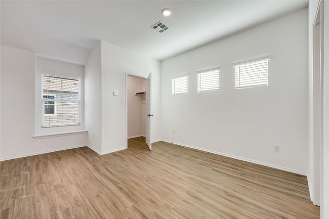 Garage apartment with healthy amount of natural light and light wood finished floors | Image 36