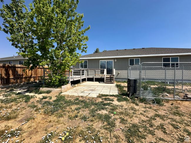 Rear view of property with a deck and a patio area | Image 24