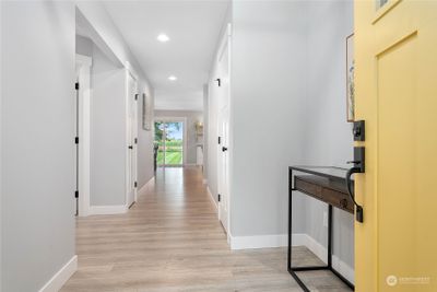 Spacious entry looking straight back to living spaces | Image 2