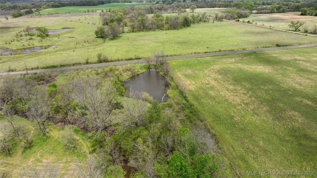 Aerial view of sparsely populated area featuring a nearby body of water | Image 44