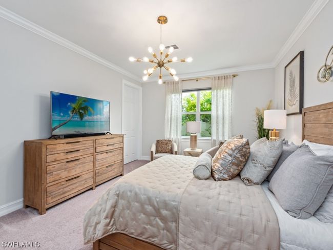 Indulge in the ultimate retreat—an expansive primary bedroom with a serene seating area, luxurious en-suite bathroom, and dual walk-in closets | Image 16