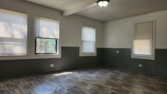 Spare room with beamed ceiling and dark wood-style floors | Image 8