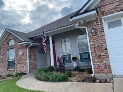 Entrance to property featuring a garage | Image 2