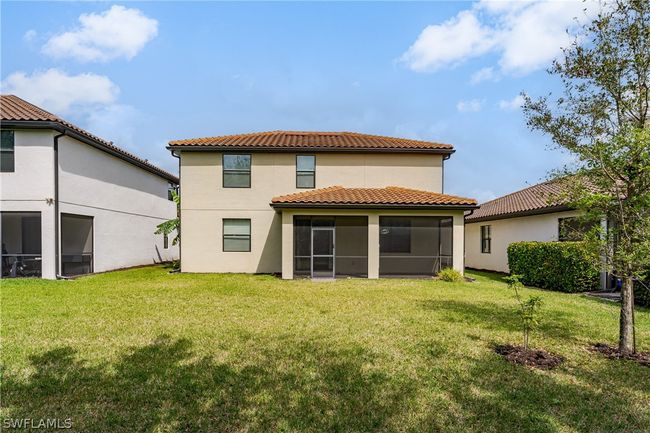 Back of house featuring a sunroom and a yard | Image 32