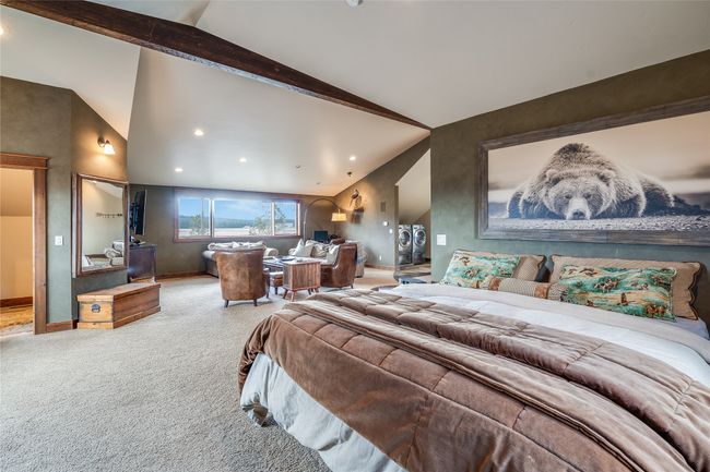 Caretaker Quarters / Guest House. Carpeted bedroom featuring recessed lighting, beamed ceiling, baseboards, and high vaulted ceiling | Image 82