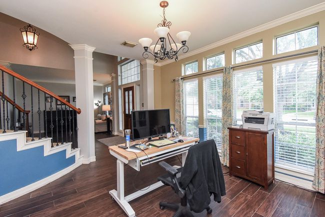 Your 14' x 15' formal dining room features a wall of windows that offer unobstructed views to your front yard. This room is also a flex space that can also be used as your home office – whatever your life season needs today. | Image 5