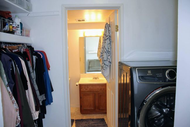 walk-thru closet has laundry. Laundry hook ups are limited in development. This is a plus. | Image 13