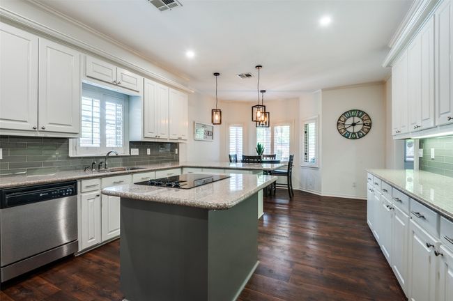 Kitchen with subway tile backsplash, island | Image 12