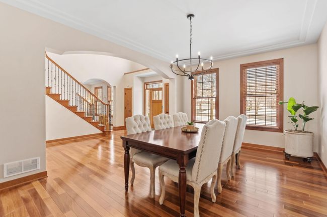 Imagine holiday meals around a large table in this informal dining space. | Image 5