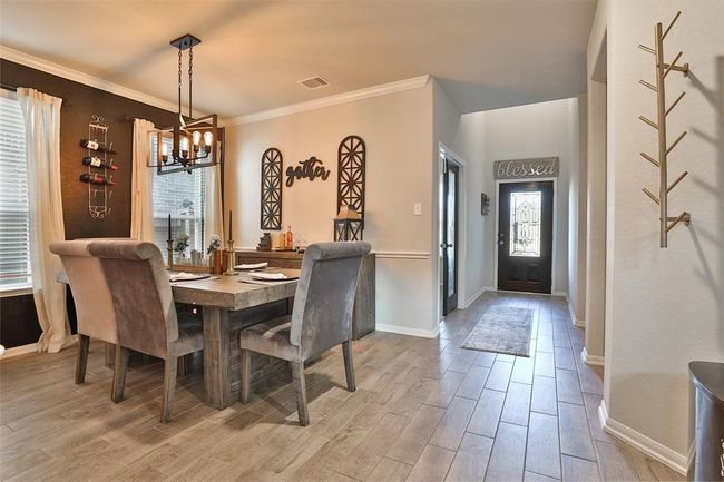 Step into the dining room, where you can relax and enjoy your meal in a welcoming space. | Image 5