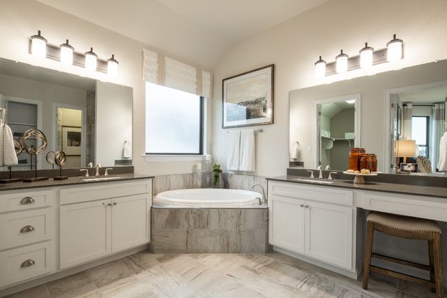 Bathroom with two vanities, a garden tub, and vaulted ceiling | Image 18