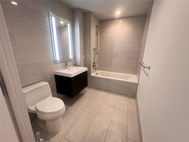 Bathroom with tiled shower / bath and vanity | Image 7
