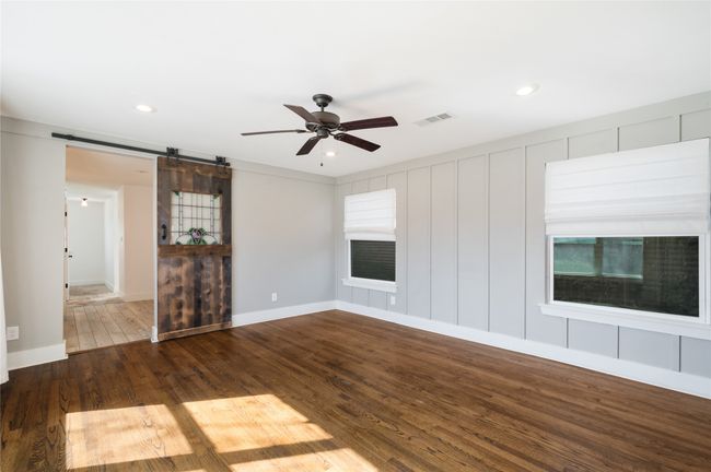 Custom sliding barn door leading into the primary bathroom | Image 18