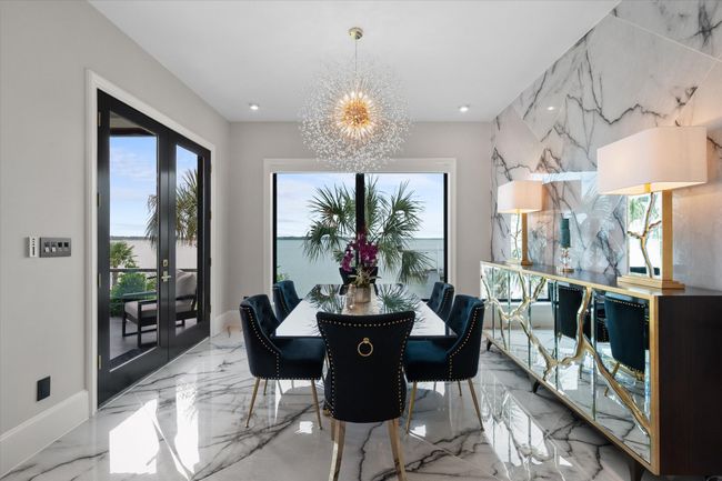 Dining room with recessed lighting, baseboards, a chandelier, and marble finish floor | Image 11