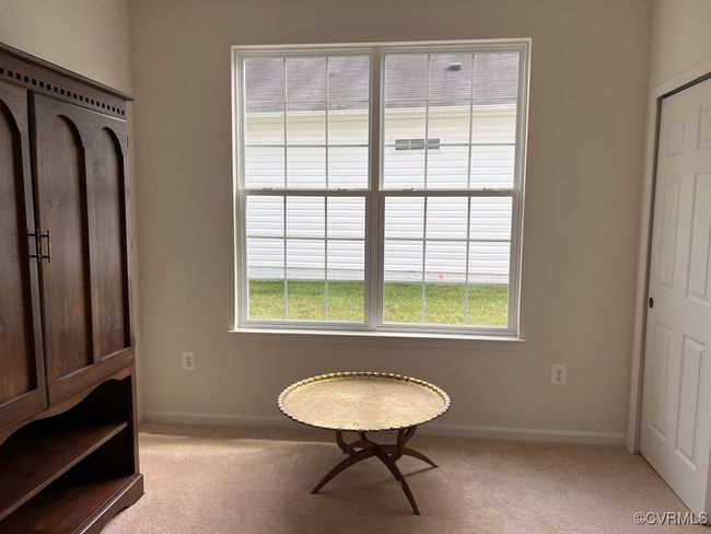 Living area featuring light colored carpet | Image 39
