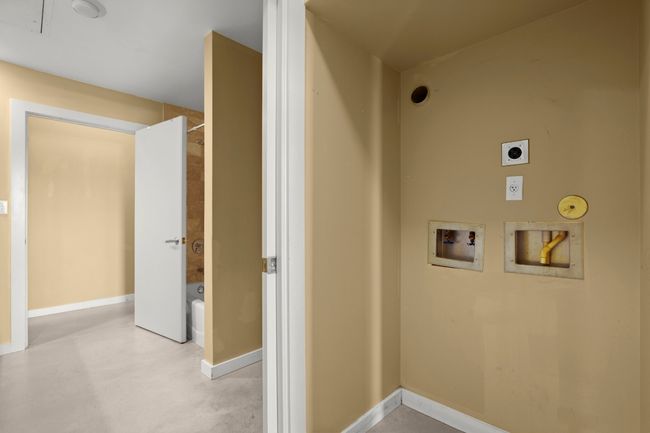 Washer/Dryer and bathroom entrance from bedroom | Image 9