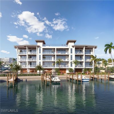 View of pool with a water view and a boat dock | Image 3