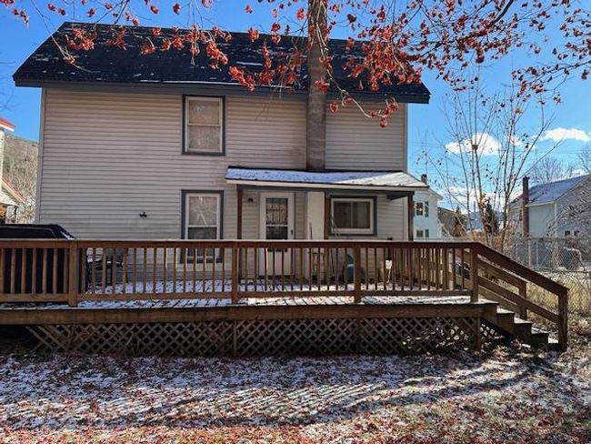 Rear view of property featuring a deck | Image 21