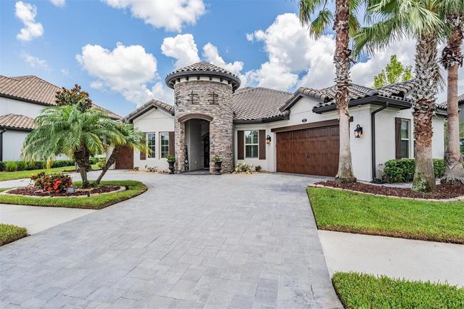 paver circle drive and lush landscaping | Image 47