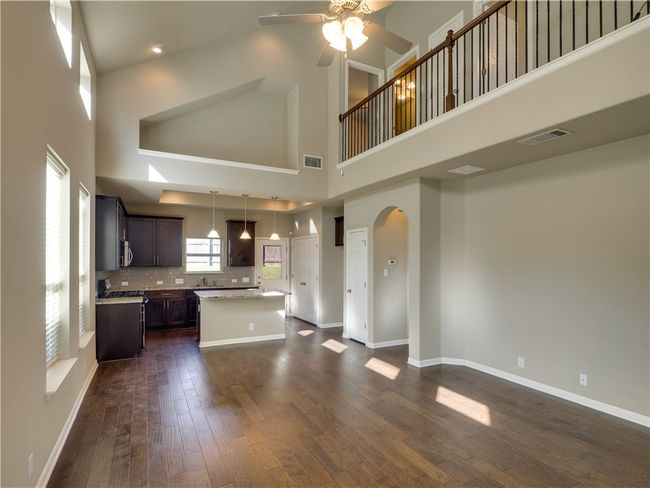 PICS reused from original listing. Spacious living room with double ceiling brings in plenty of light. Open and modern floor plan. | Image 5