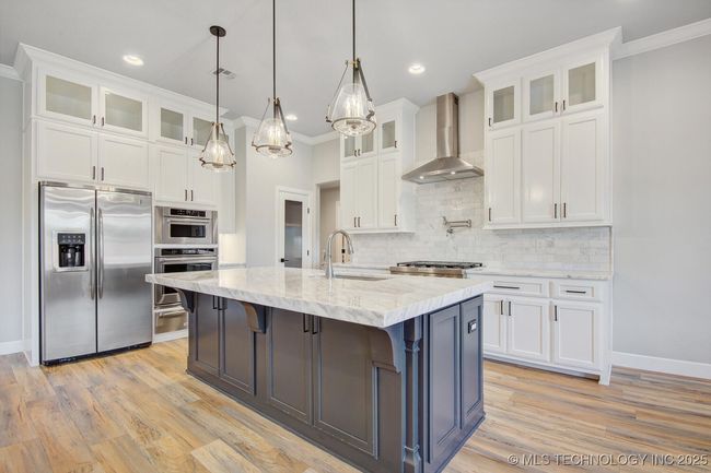 Upgraded cabinets and luxurious, extra thick, Dolomite Island. | Image 13
