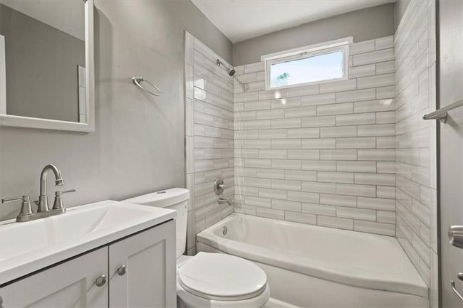 Bathroom with vanity and shower / bath combination | Image 16