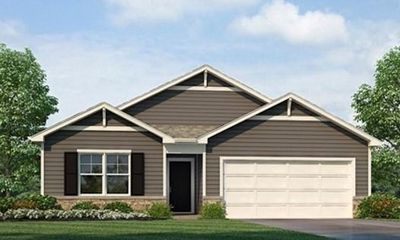 View of front of home with a front lawn and a garage | Image 1