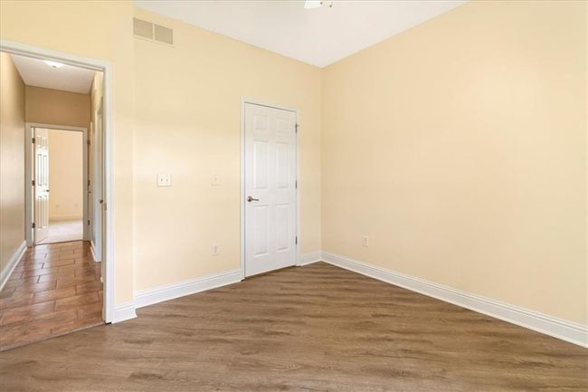 Unfurnished bedroom featuring baseboards, visible vents, and wood finished floors | Image 21