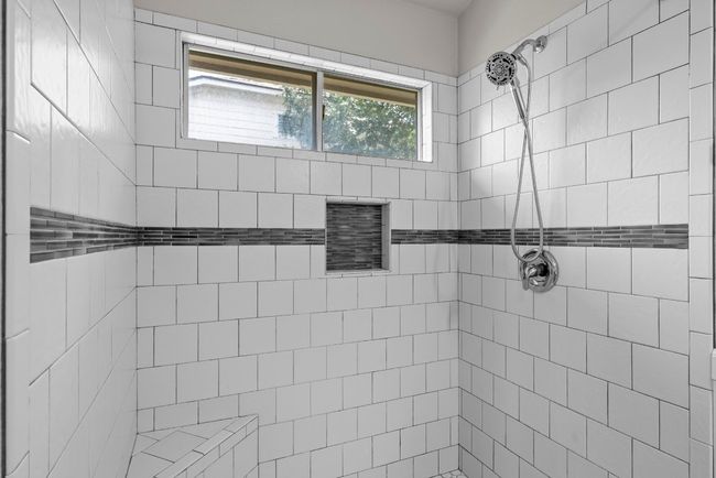 Full bathroom featuring tiled shower | Image 15
