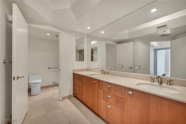 Primary Bathroom with dual sinks & vanities.Separate room for private moments. | Image 36