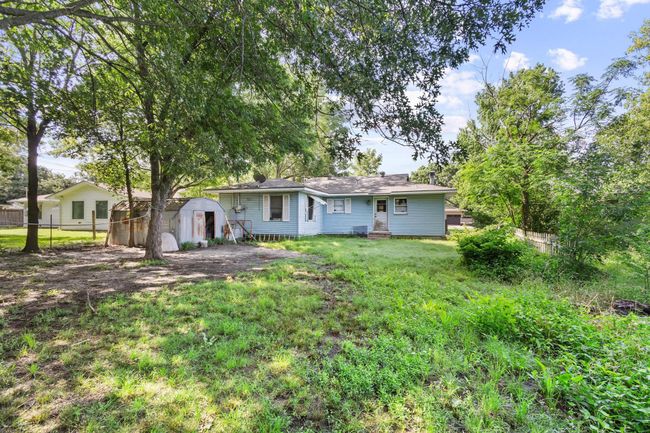 Rear view of property featuring a shed | Image 14