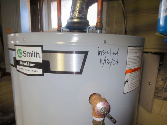 Room details featuring gas water heater | Image 25