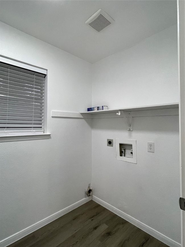 Laundry area with washer hookup, dark hardwood / wood-style floors, and hookup for an electric dryer | Image 16