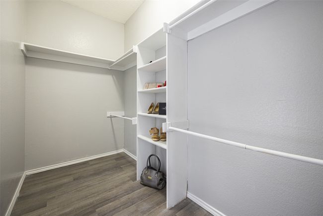 Spacious closet with LVP flooring and storage space | Image 16