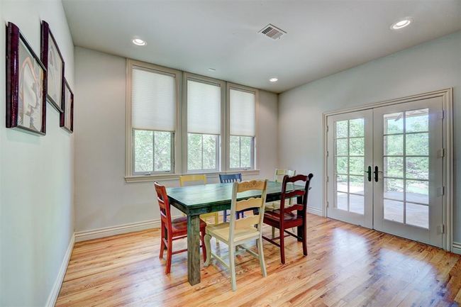 Dining area with french doors, light wood-style flooring, baseboards, visible vents, and recessed lighting | Image 16