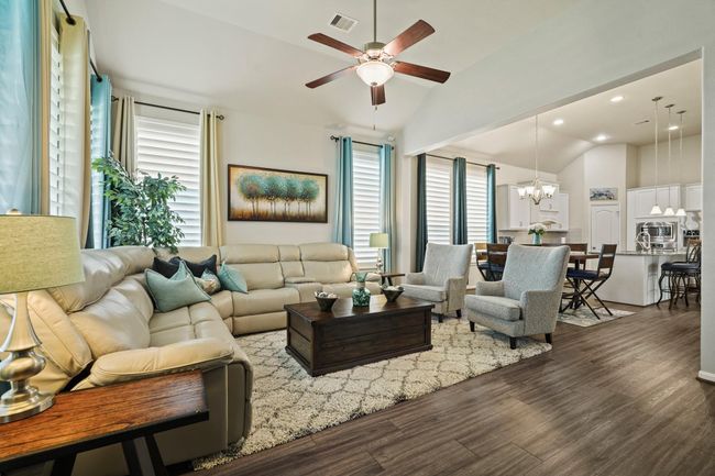 This expansive open-concept room offers versatile possibilities for entertaining, intimate family moments, or a dynamic blend of living and dining experiences. | Image 16