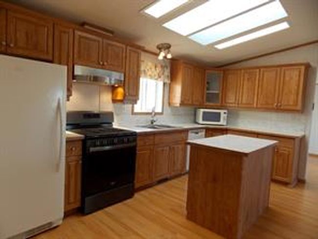 77 - 5210 65 Ave, Home with 3 bedrooms, 2 bathrooms and 3 parking in Olds AB | Image 11