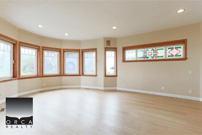 Empty room featuring light wood-style flooring, recessed lighting, and ornamental molding | Image 20