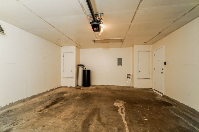 Garage with a garage door opener and electric panel | Image 24