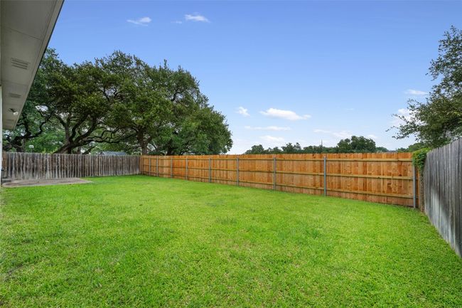 View of fenced backyard | Image 38