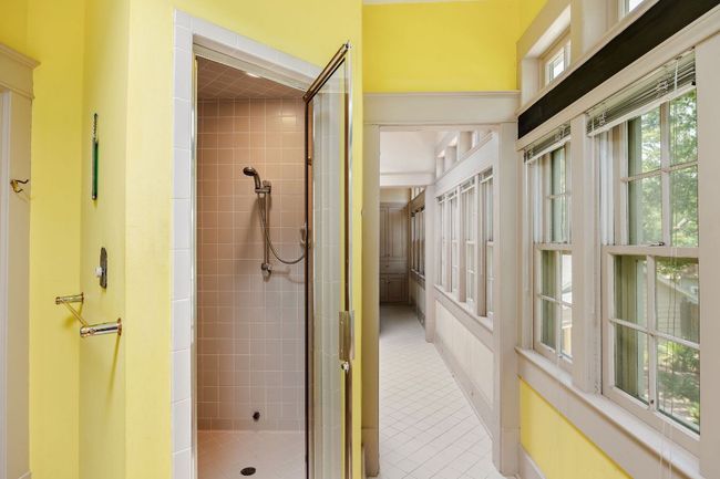 Bathroom with a stall shower and tile patterned flooring | Image 25