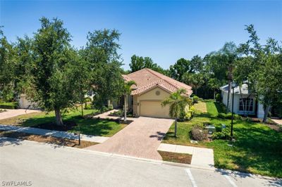 Mediterranean / spanish house with a garage and a front lawn | Image 3