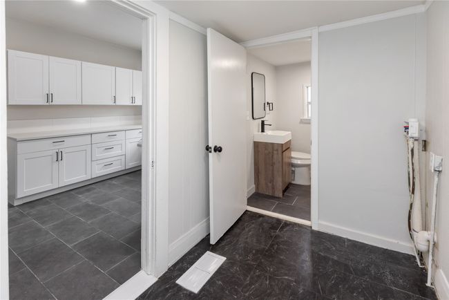 Bathroom featuring vanity, toilet, and baseboards | Image 37