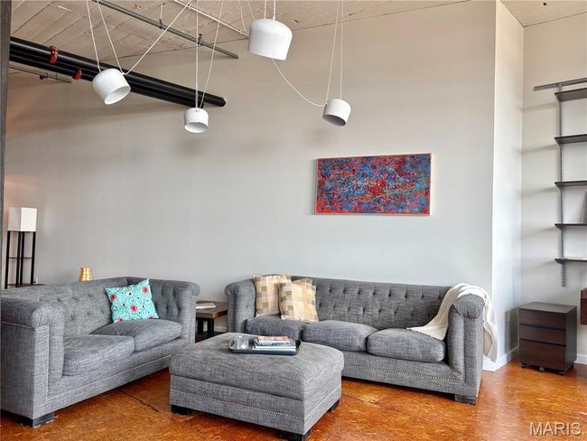 Living room with baseboards | Image 7