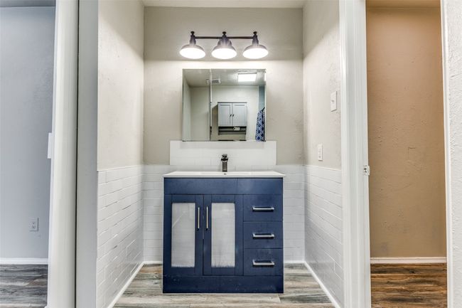 Bathroom with wood finished floors and vanity | Image 22