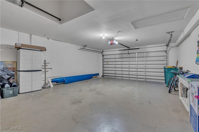 Garage with a garage door opener | Image 27