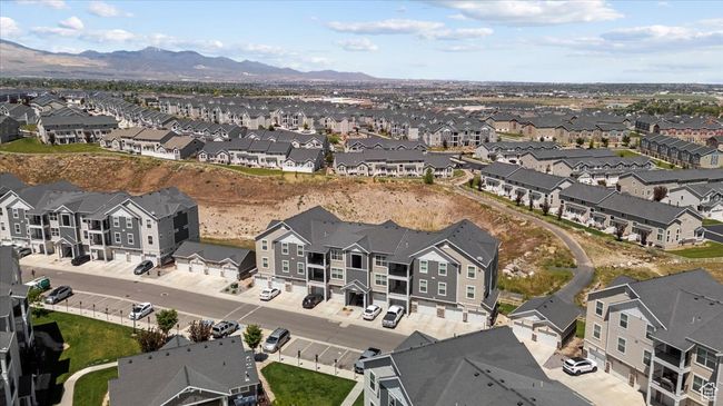 Aerial view of property and surrounding area with nearby suburban area and a mountain backdrop | Image 21