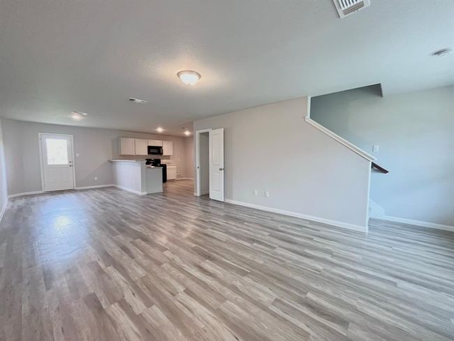 Spacious open-concept living area, beautifully enhanced with virtual staging. | Image 30